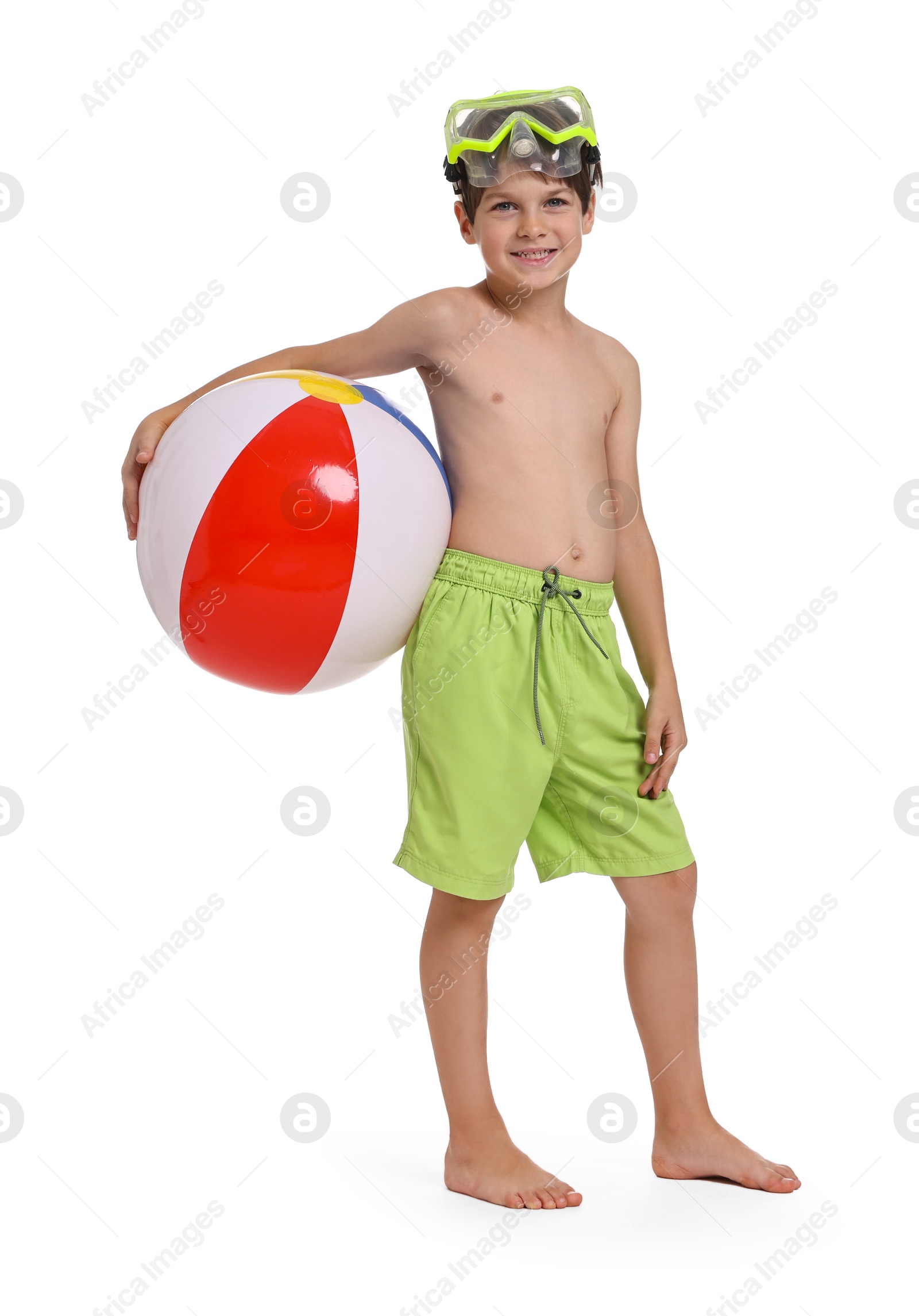 Photo of Happy little boy in beachwear with inflatable ball and diving mask on white background