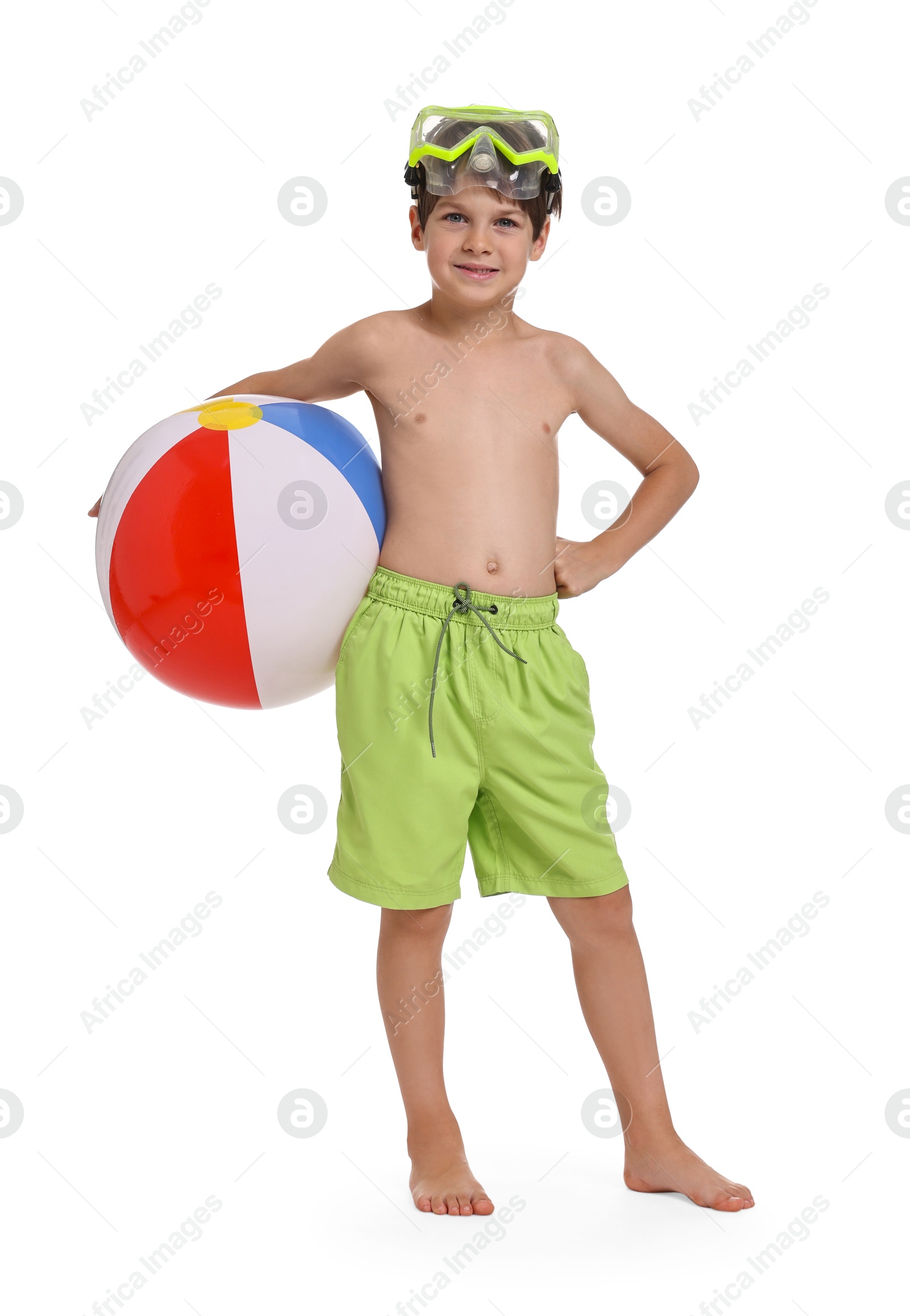 Photo of Happy little boy in beachwear with inflatable ball and diving mask on white background