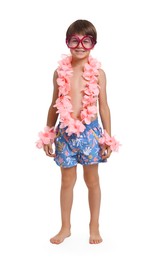 Photo of Little boy in beachwear and wreaths of flowers on white background