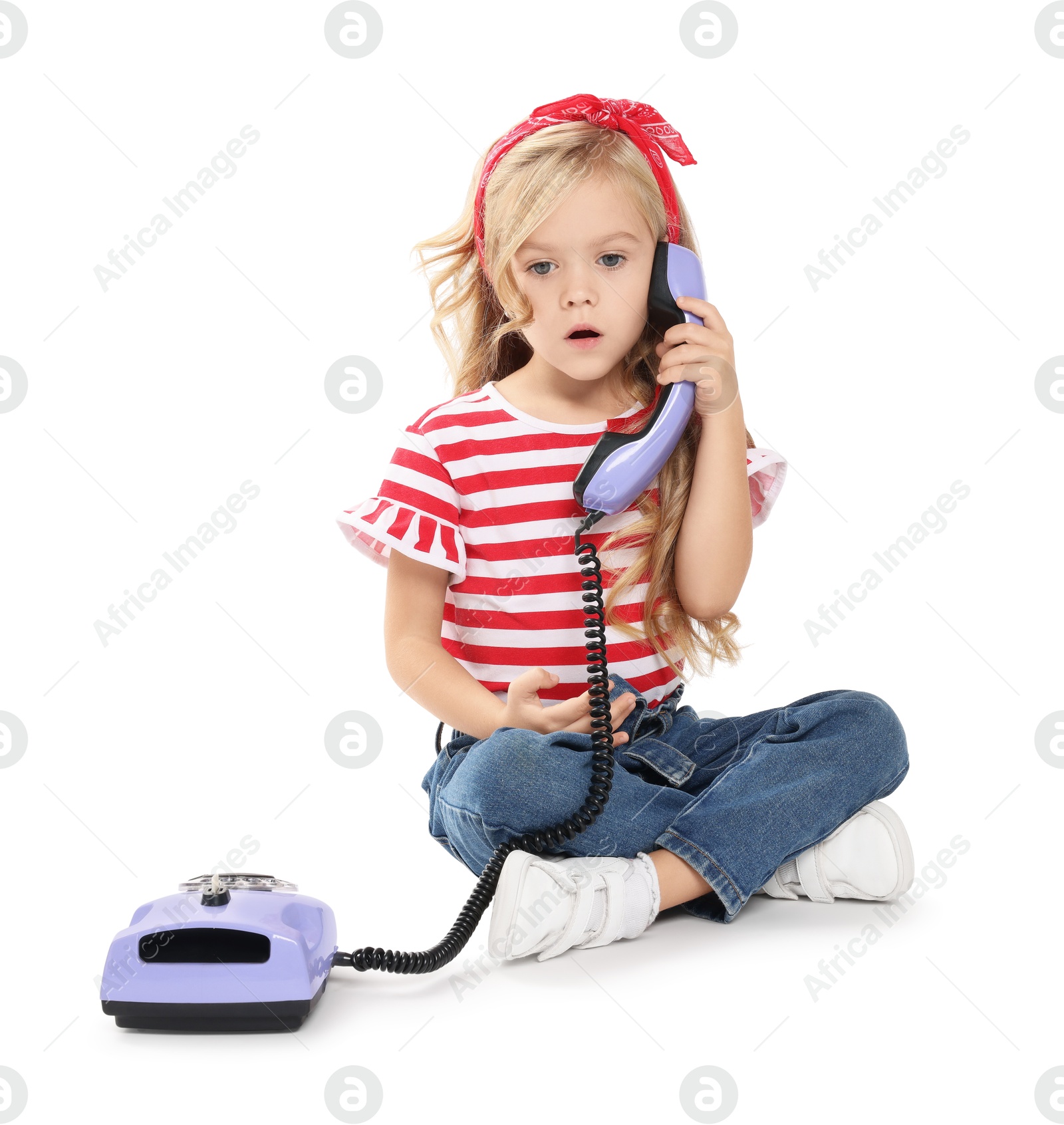 Photo of Cute little girl with telephone on white background