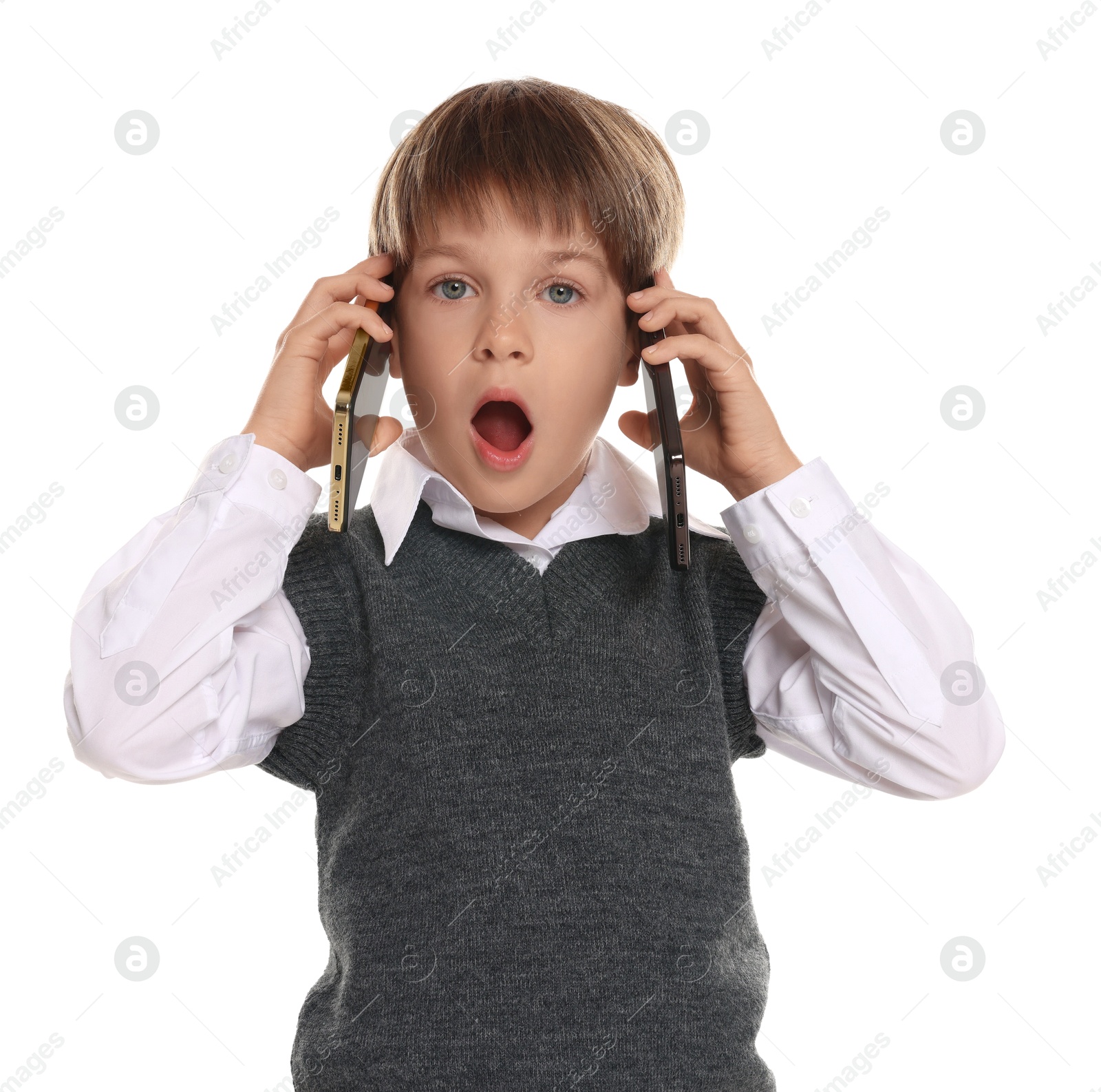 Photo of Little boy with smartphones on white background