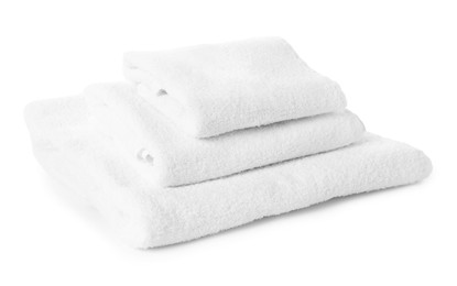 Photo of Stacked clean terry towels on white background