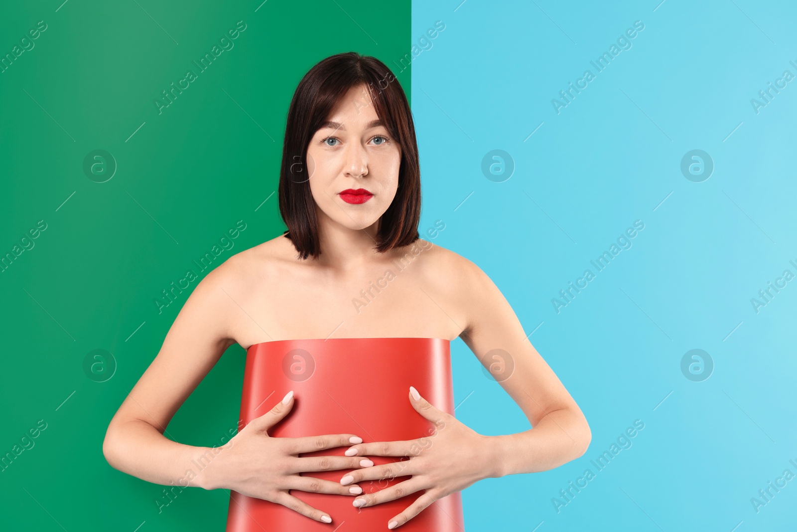 Photo of Beautiful young woman posing on color background