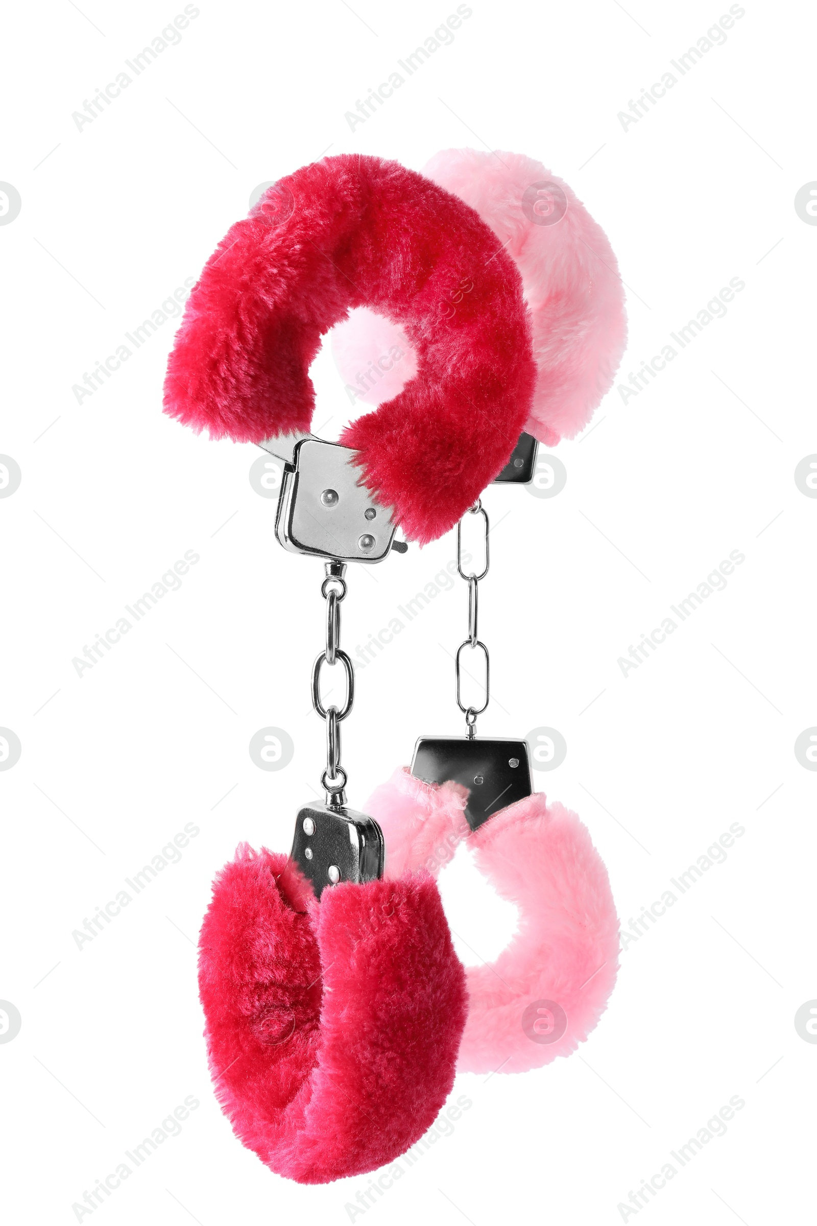 Photo of Bright fluffy handcuffs in air on white background