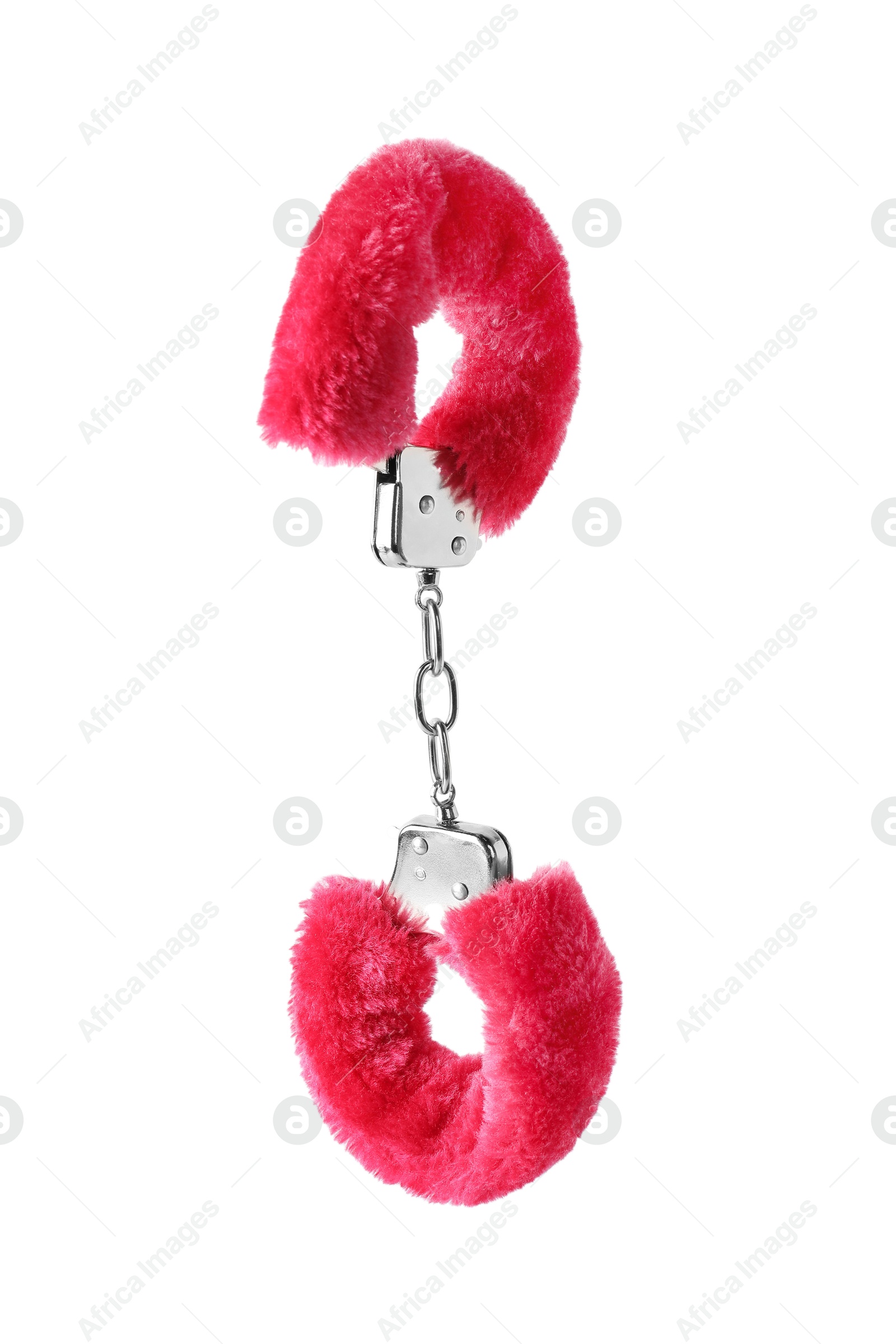 Photo of Bright fluffy handcuffs in air on white background