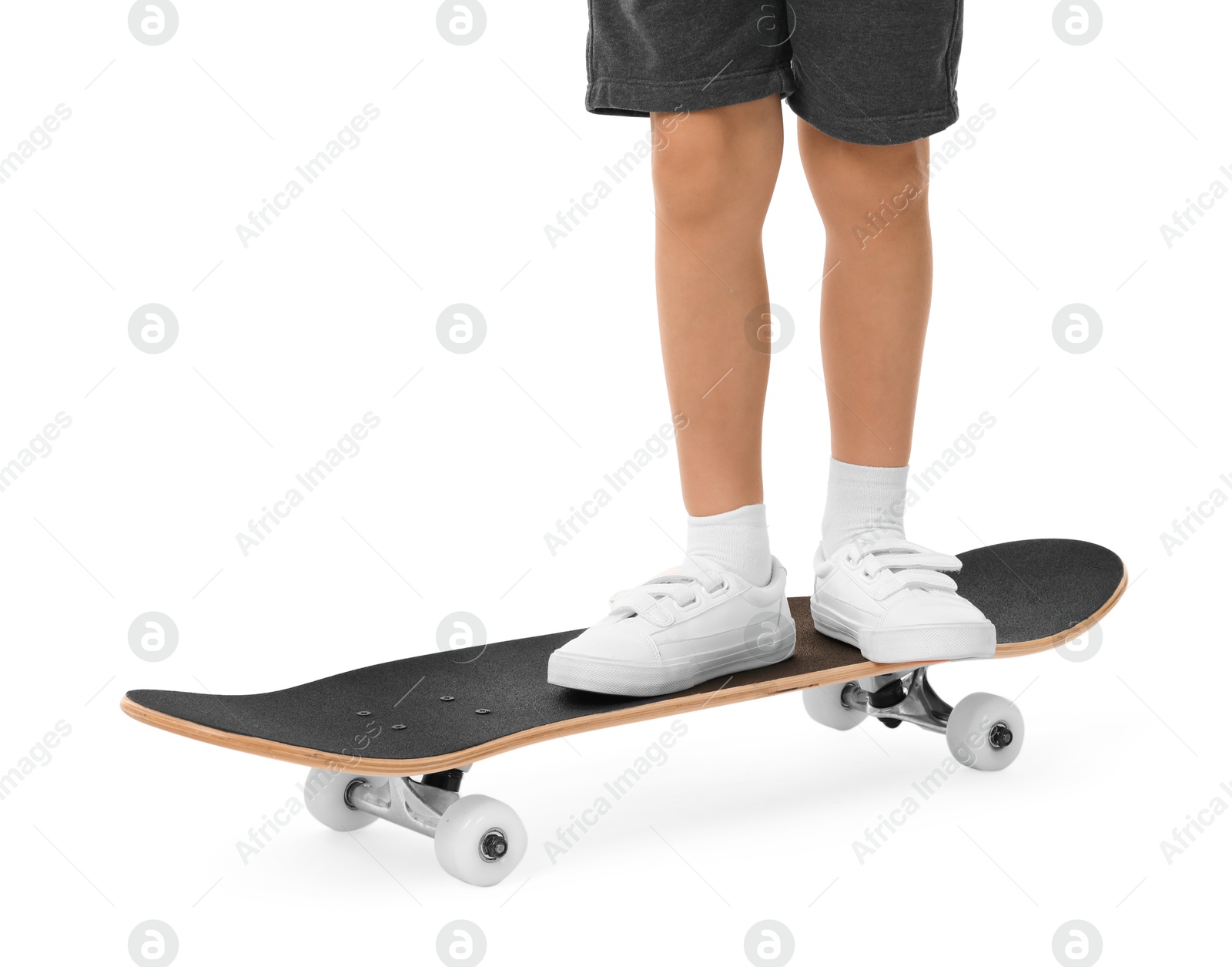 Photo of Little boy with skateboard on white background, closeup