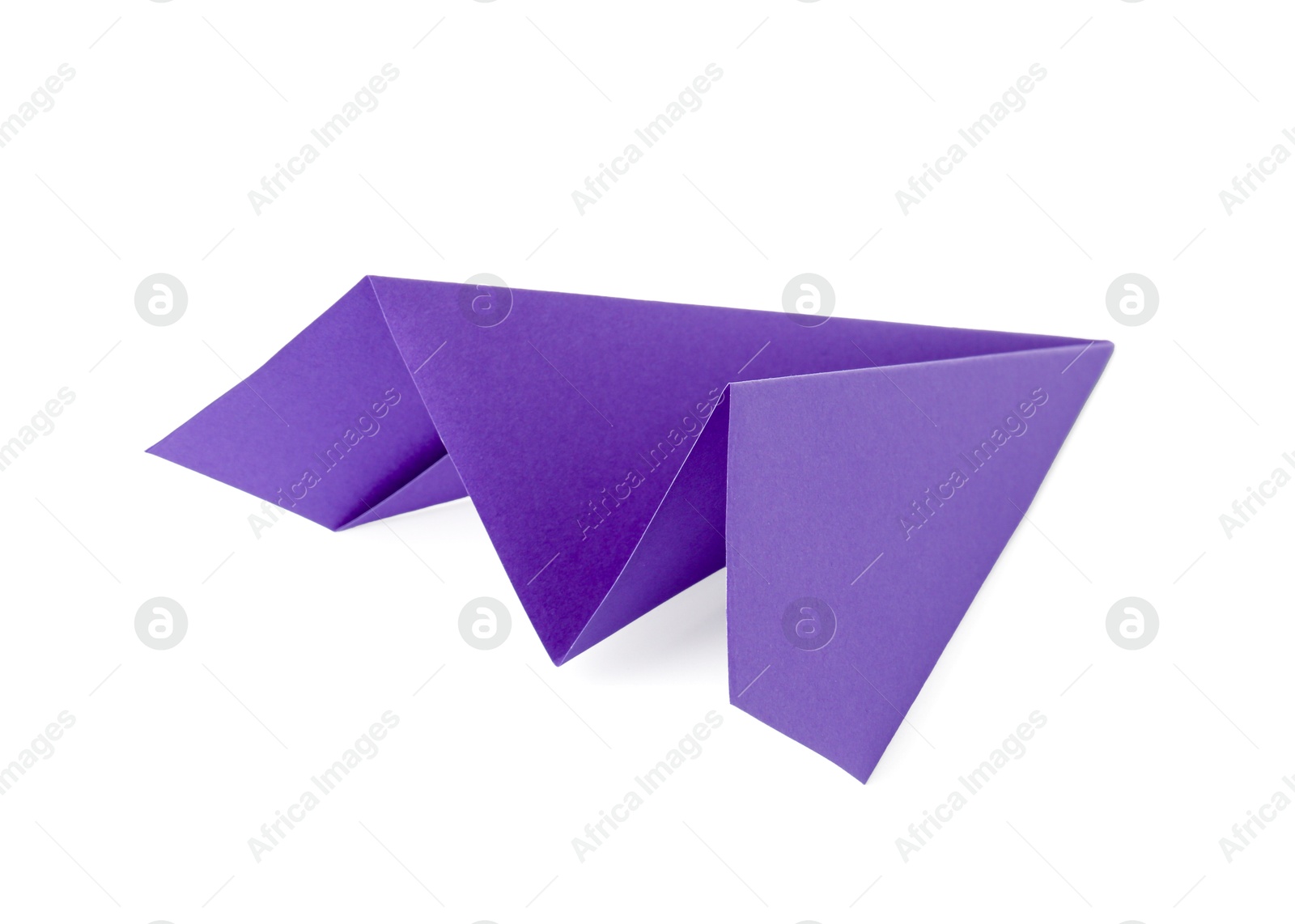 Photo of One handmade purple paper plane isolated on white