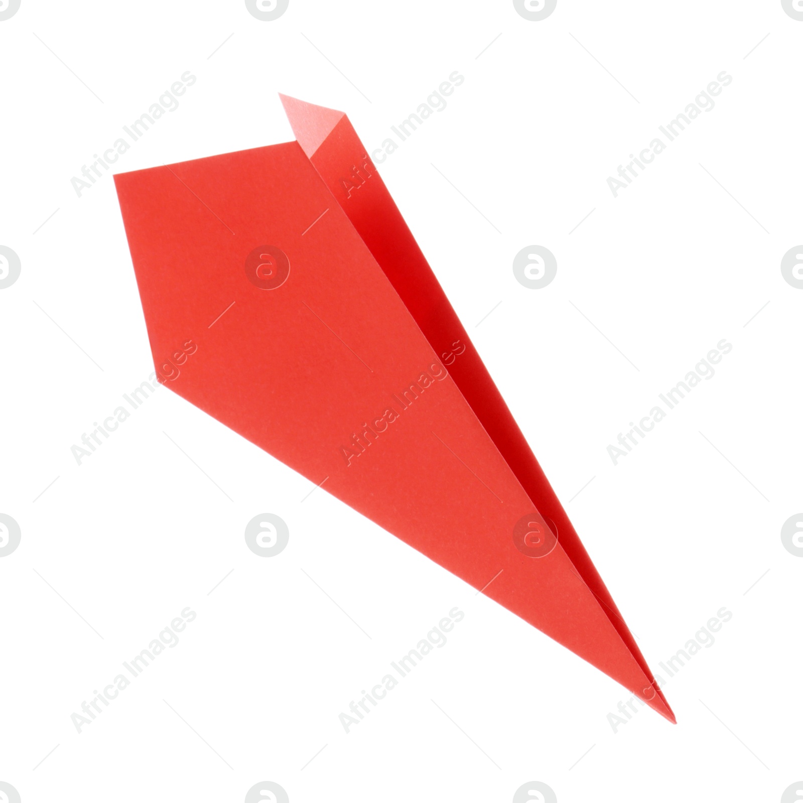 Photo of One handmade coral paper plane isolated on white