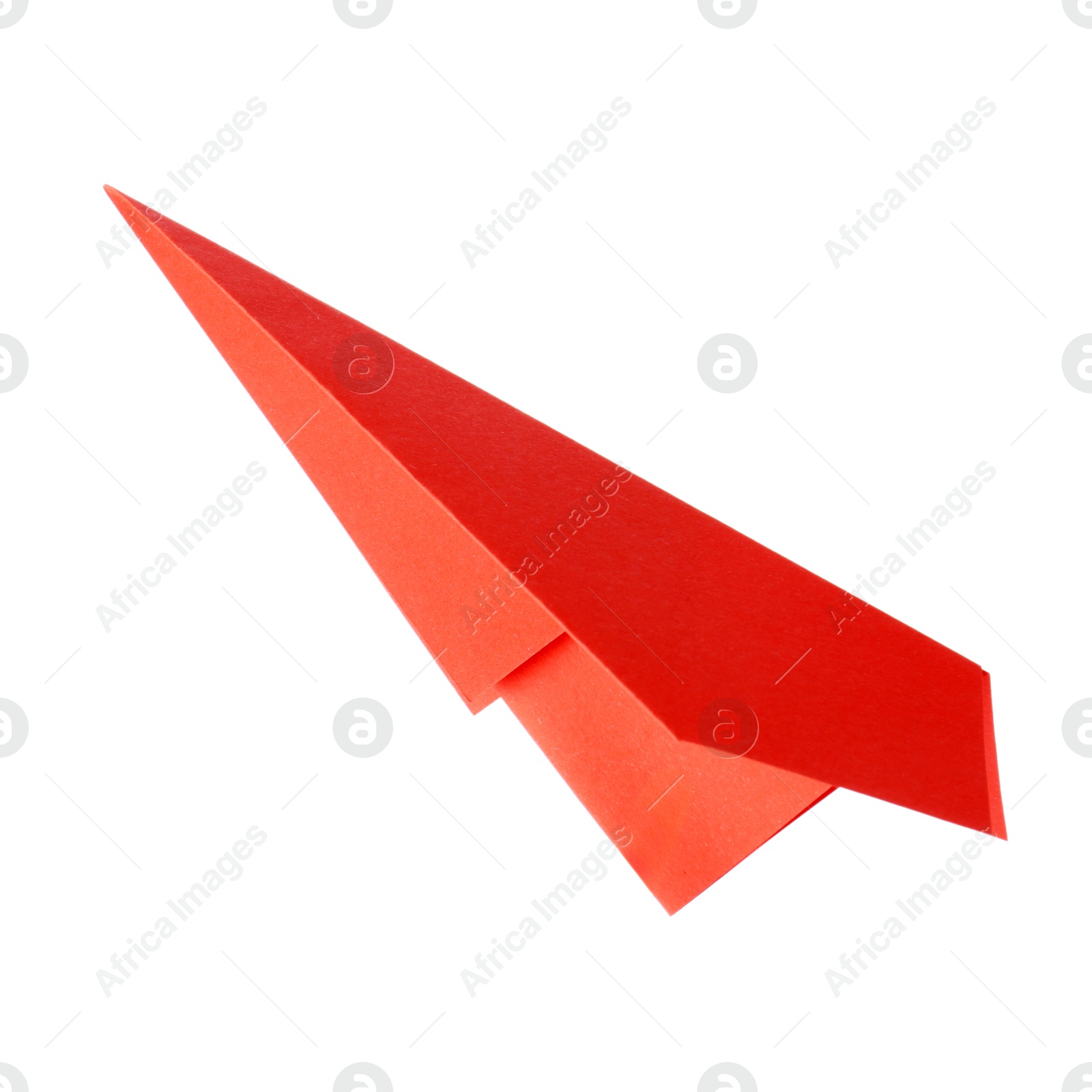 Photo of One handmade coral paper plane isolated on white