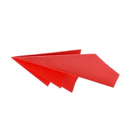 Photo of One handmade coral paper plane isolated on white