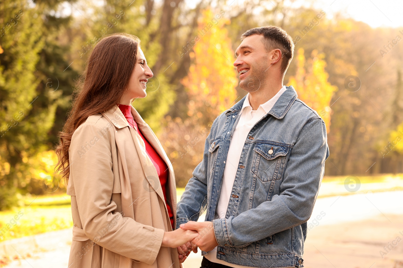 Photo of Happy couple spending time together in autumn park