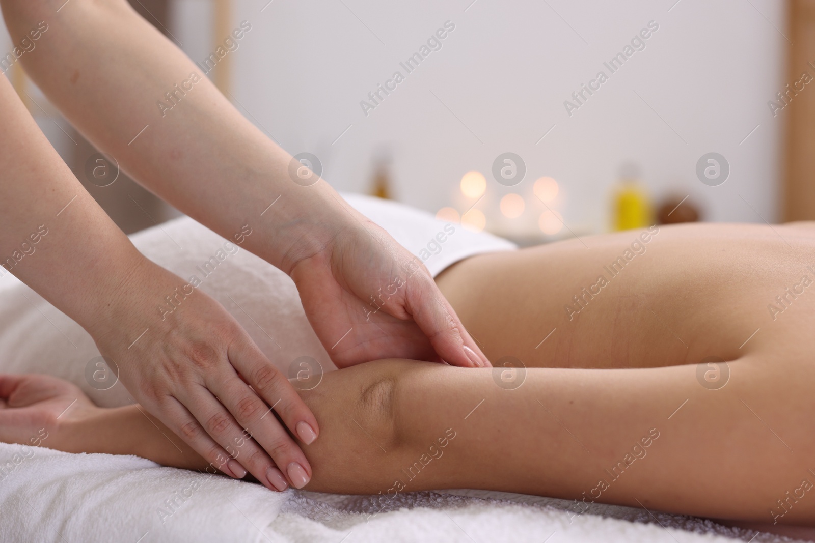 Photo of Woman receiving massage in spa salon, closeup