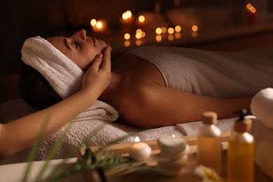 Young woman receiving massage in spa salon