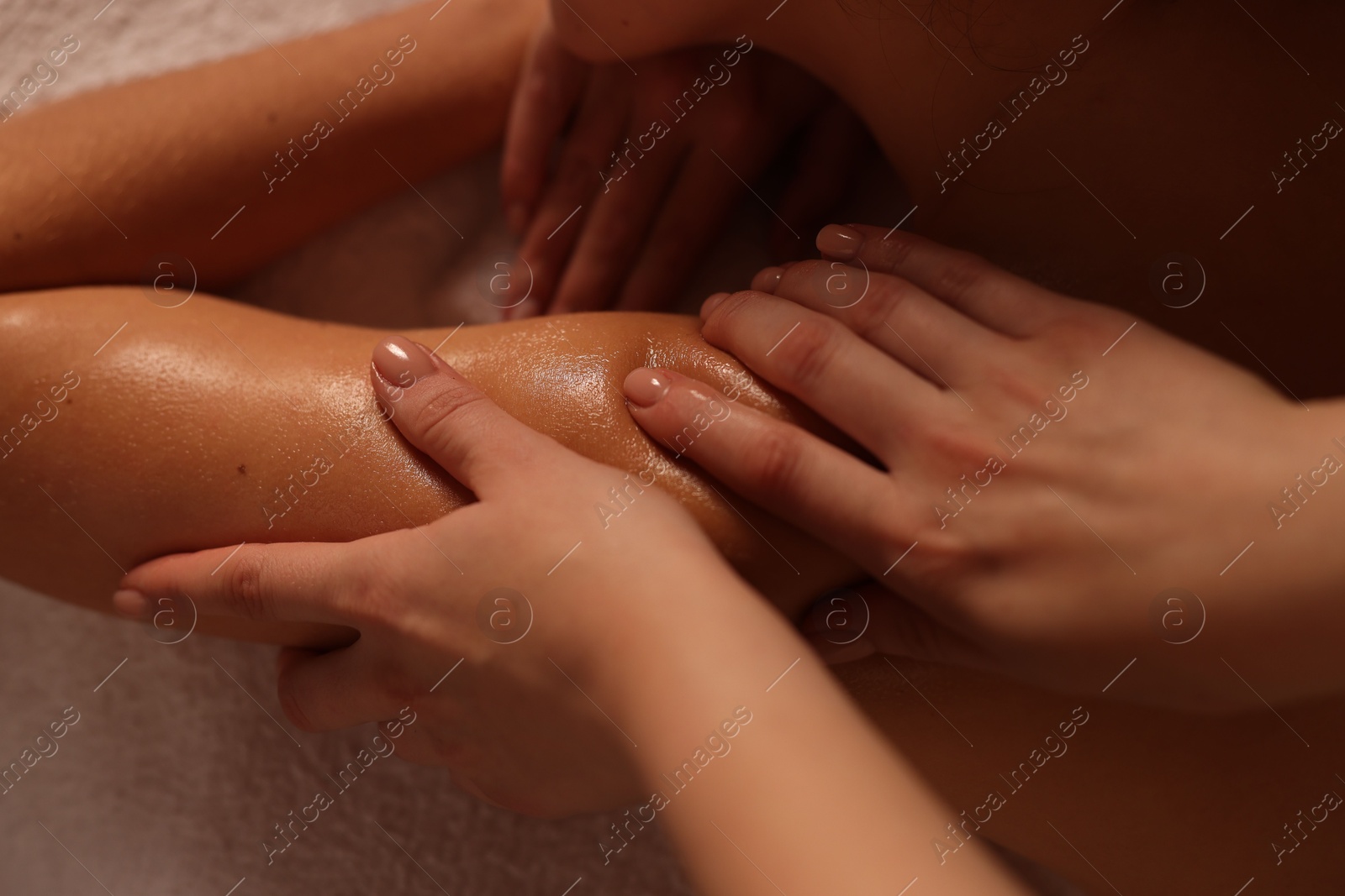 Photo of Woman receiving massage in spa salon, closeup