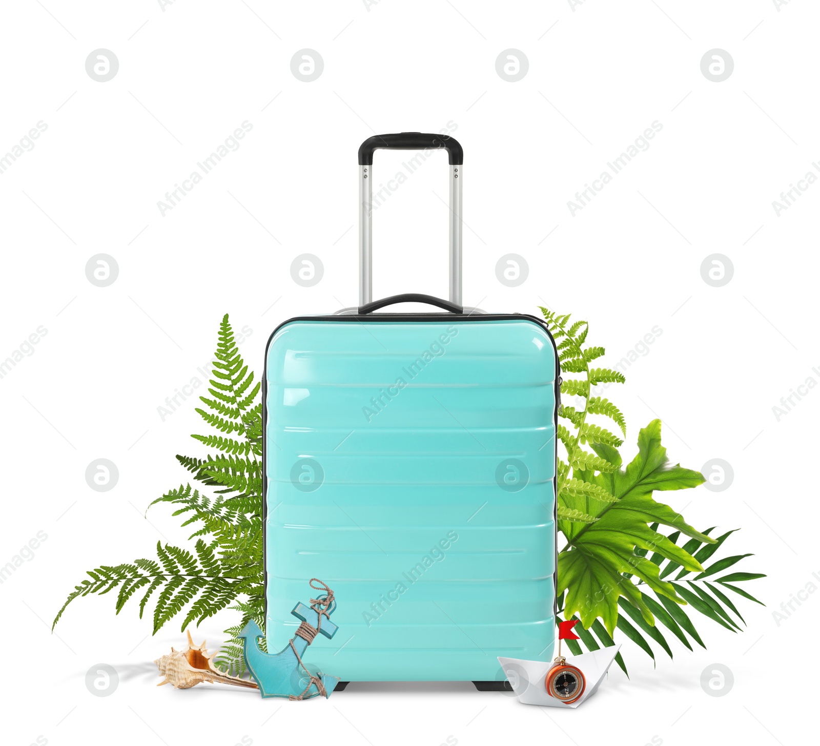 Image of Turquoise travel suitcase, tropical leaves, toy anchor, paper boat and seashell on white background