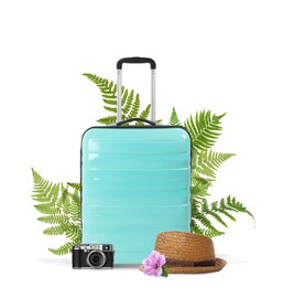 Image of Turquoise travel suitcase, camera, hat, tropical leaves and flower on white background