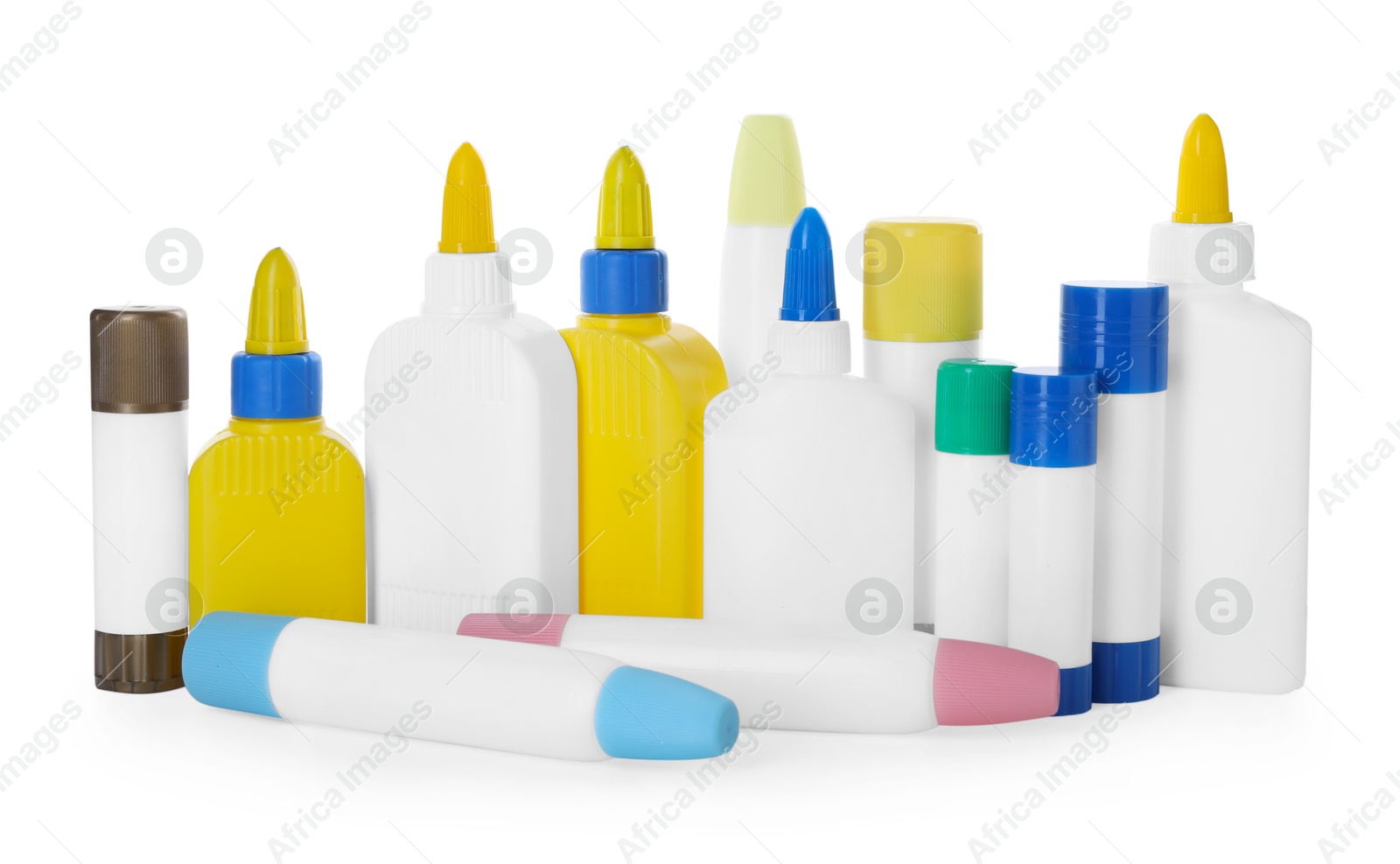 Photo of Bottles and sticks of glue on white background