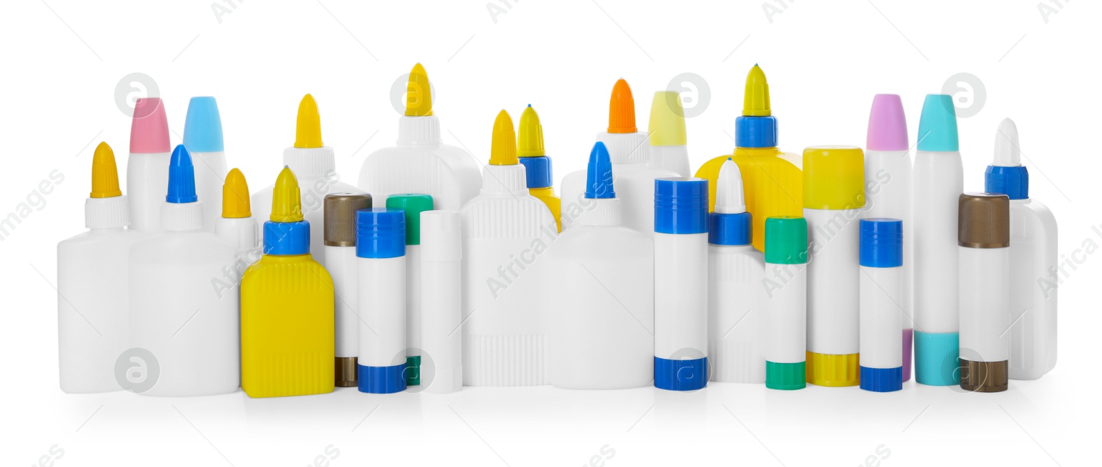 Photo of Bottles and sticks of glue on white background