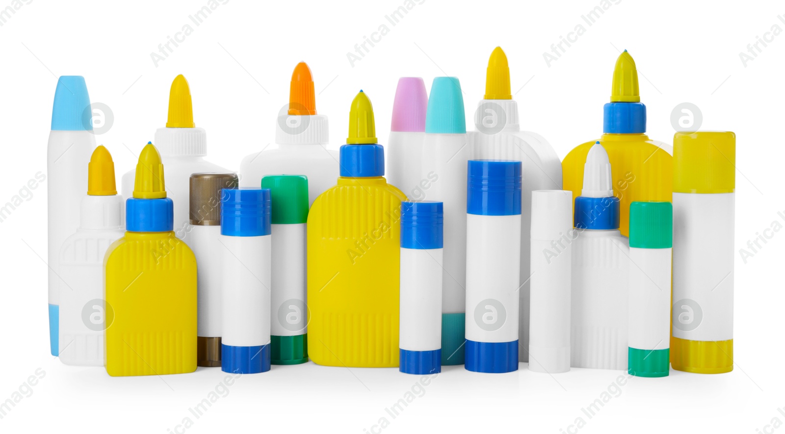 Photo of Bottles and sticks of glue on white background