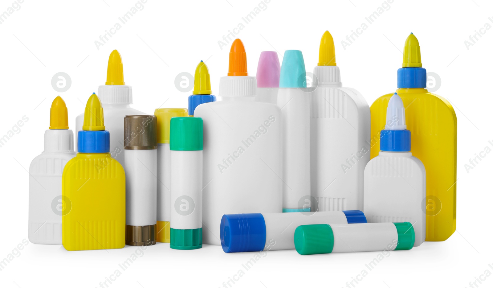 Photo of Bottles and sticks of glue on white background