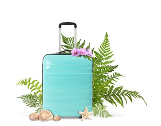 Turquoise travel suitcase, seashells, sea star, tropical leaves and flowers on white background