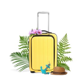 Yellow travel suitcase, hat, toy anchor, tropical leaves and flowers on white background