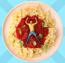 Creative poster with ketchup on light blue striped background. Man lying in sauce on plate with pasta. Art collage