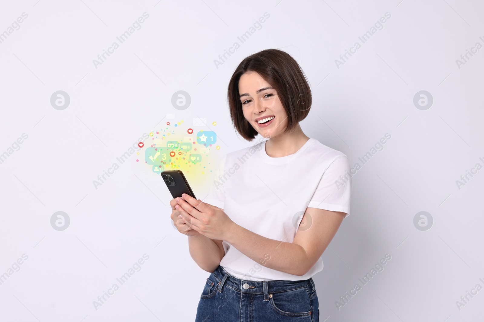 Image of Happy woman using mobile phone on white background. Different notification signs over gadget