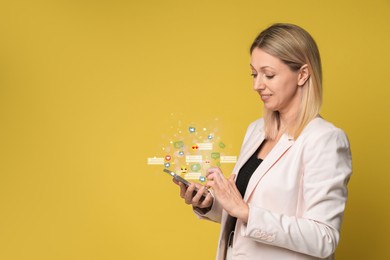 Image of Happy woman using mobile phone on orange background. Different notification signs over gadget