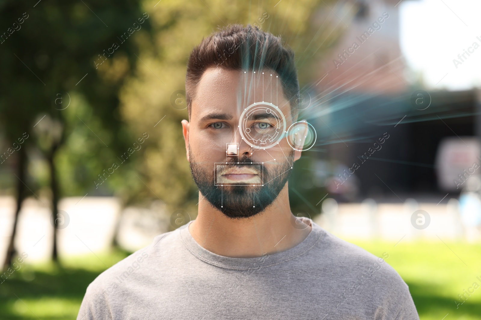 Image of Facial and iris recognition system. Man undergoing biometric verification outdoors