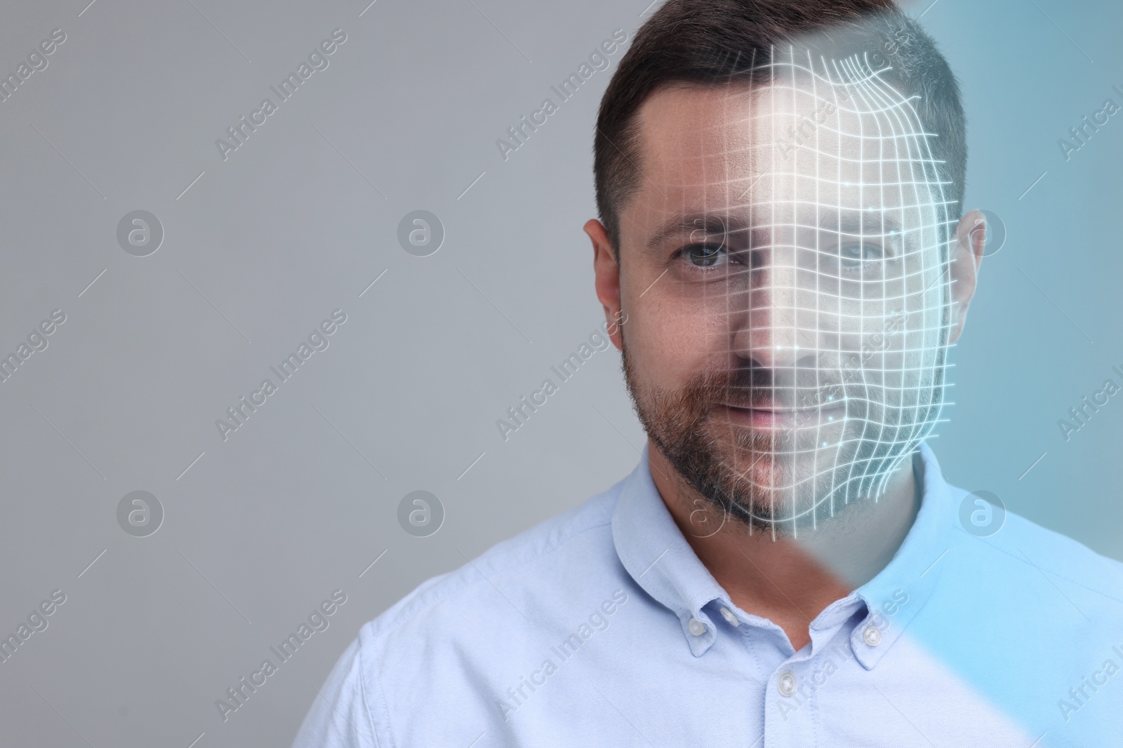 Image of Facial recognition system. Man undergoing biometric verification on grey background