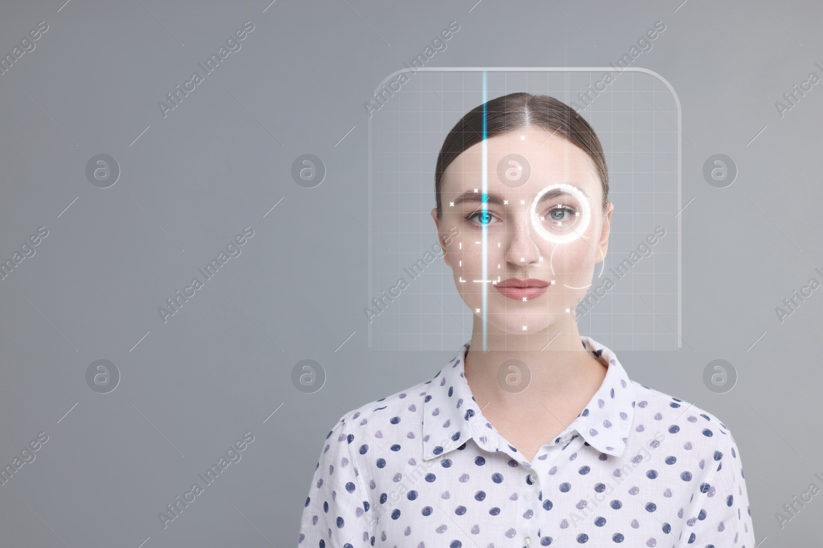 Image of Facial and iris recognition system. Woman undergoing biometric verification on grey background