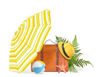 Image of Brown travel suitcase, tropical leaves, beach umbrella and ball, hat and sea star on white background