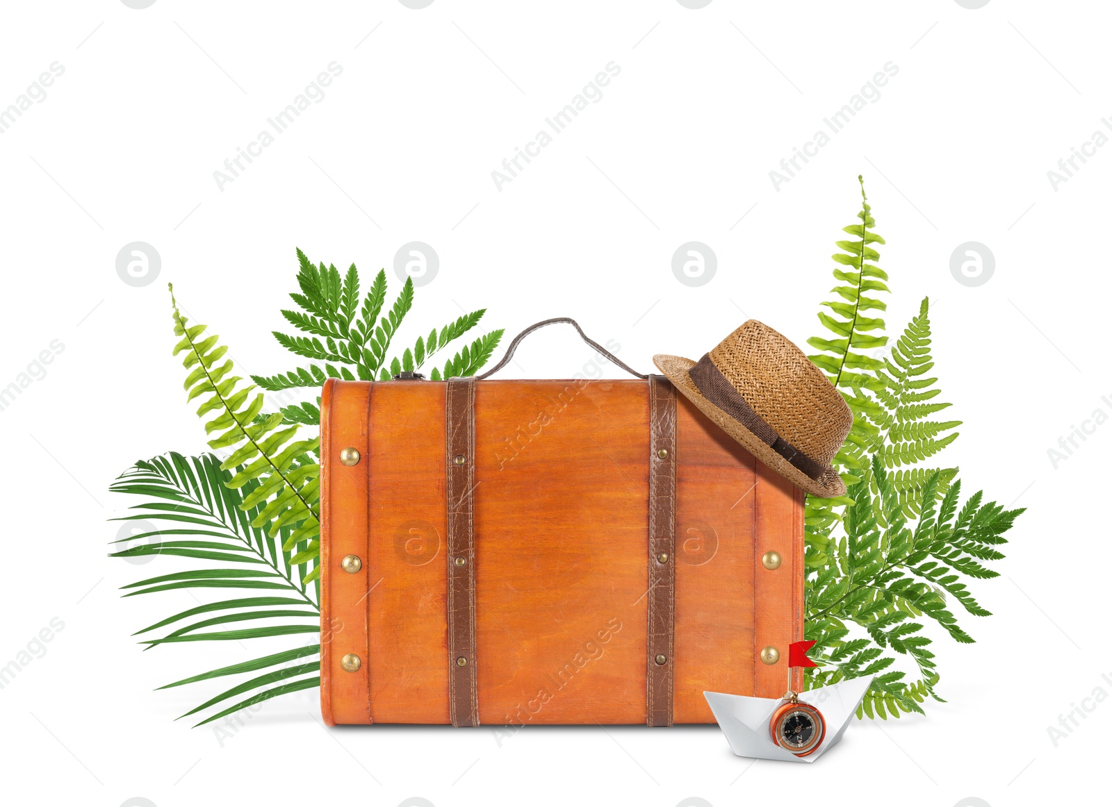 Image of Brown travel suitcase, tropical leaves, hat and paper boat on white background