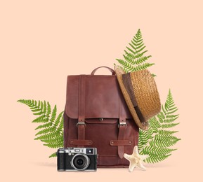 Leather backpack, tropical leaves, hat, sea star and camera on pink beige background. Time to travel