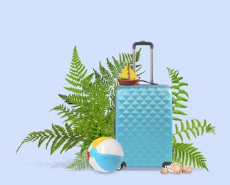 Image of Light blue travel suitcase, tropical leaves, beach ball, toy sailboat and seashells on color background