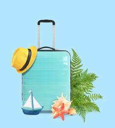 Image of Turquoise travel suitcase, tropical leaves, hat, sea star, seashells and toy sailboat on light blue background