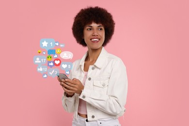 Image of Happy woman using mobile phone on pink background. New message sign and other notifications over gadget