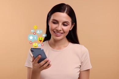 Image of Happy woman using mobile phone on dark beige background. New message sign and other notifications over gadget