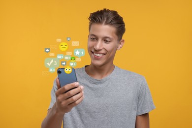 Image of Happy man using mobile phone on orange background. New message sign and other notifications over gadget