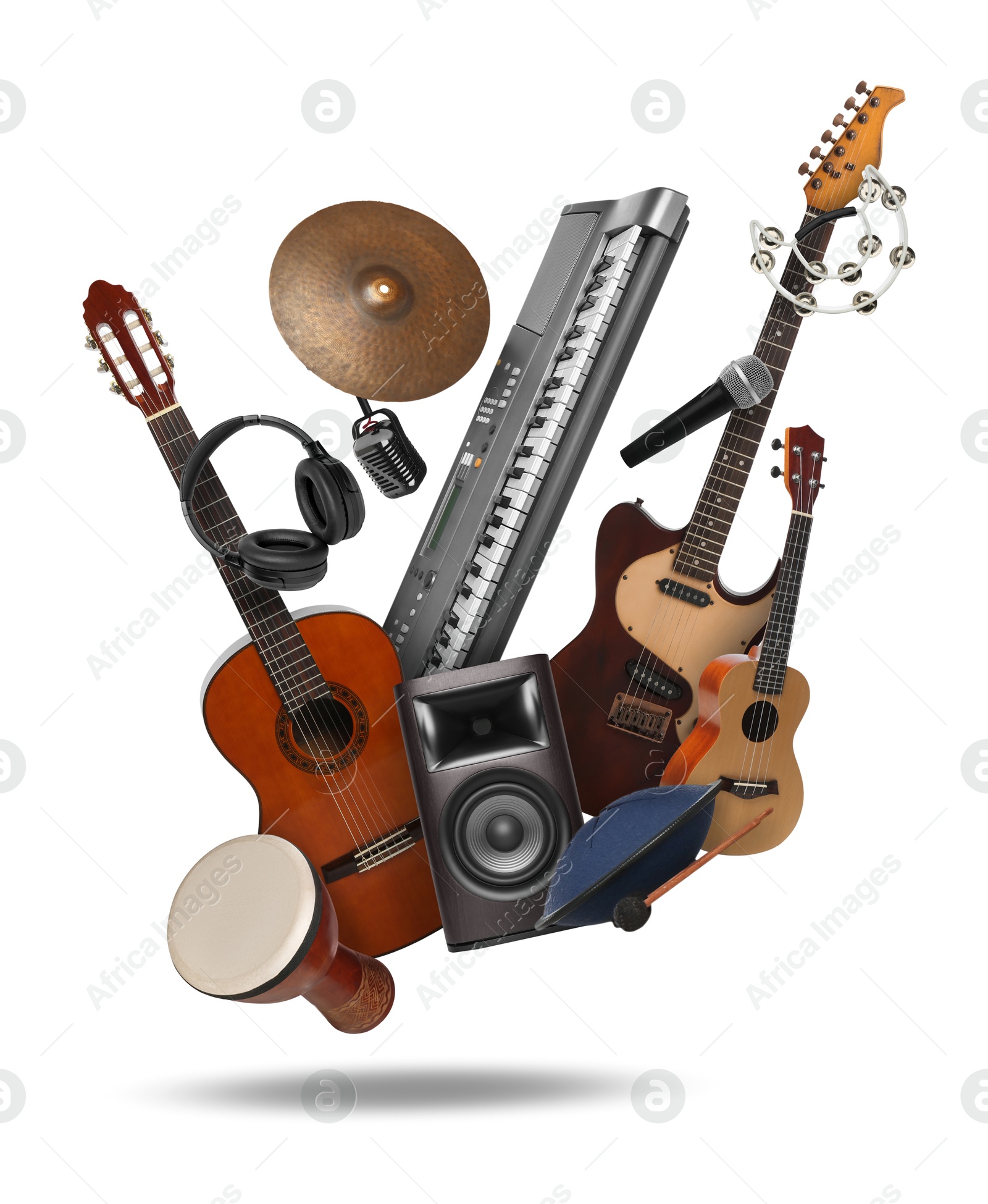 Image of Different musical instruments in air on white