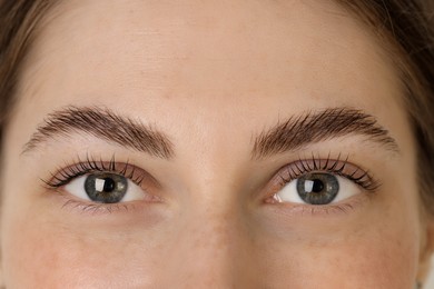 Beautiful woman after lash laminating and tinting procedure, closeup