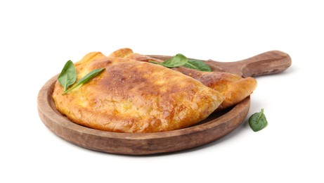 Photo of Tasty calzones with basil isolated on white