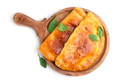 Photo of Tasty calzones with basil isolated on white, top view