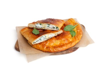 Photo of Tasty calzones with cheese and basil isolated on white