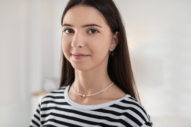 Photo of Portrait of beautiful teenage girl at home