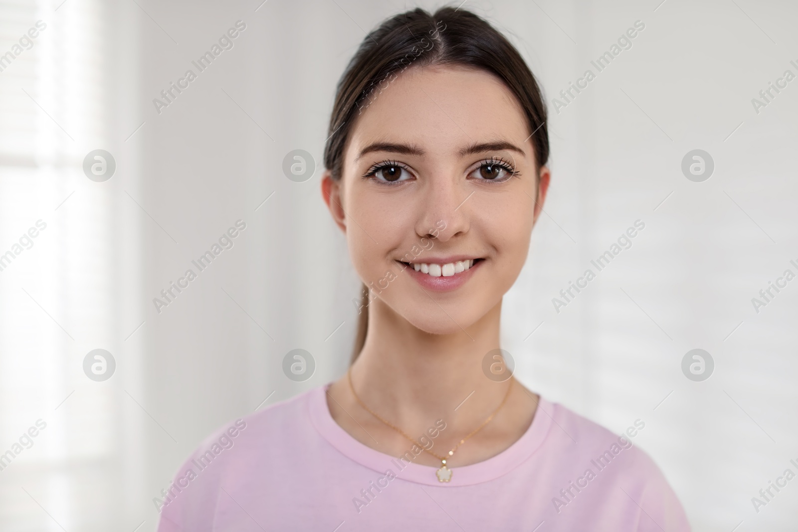 Photo of Portrait of beautiful teenage girl at home