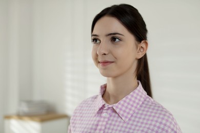 Photo of Portrait of beautiful teenage girl at home