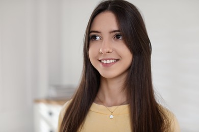 Photo of Portrait of happy teenage girl at home