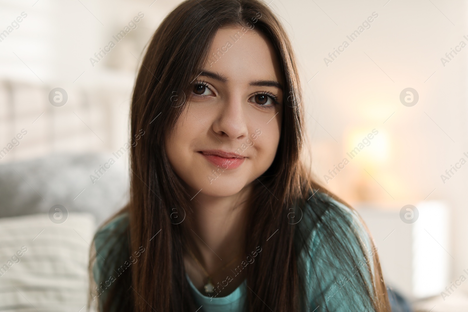 Photo of Portrait of beautiful teenage girl at home